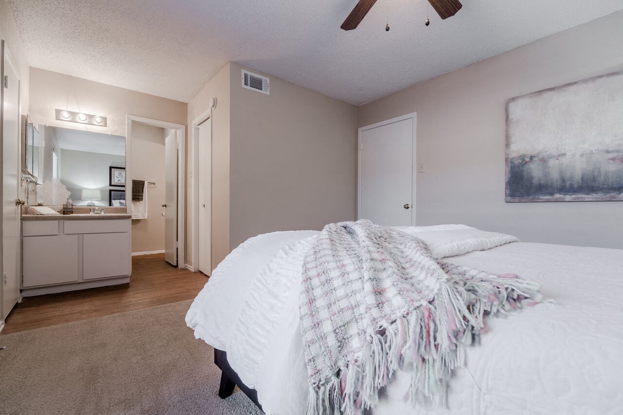bathroom with linen closet and private vanity  at Country Square, Carrollton, TX
